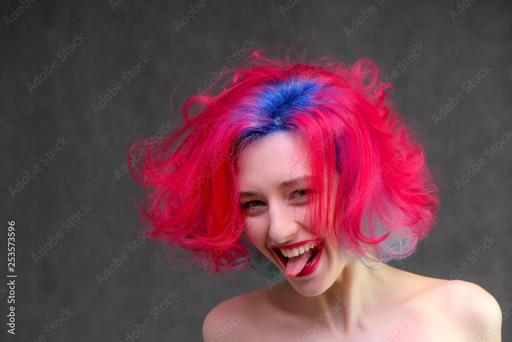 High fashion model woman with multi-colored hair posing in the studio, portrait of a beautiful sexy girl with a fashionable makeup. High fashion model woman with multi-colored hair posing in the studio, portrait of a beautiful sexy girl with a fashionable makeup.