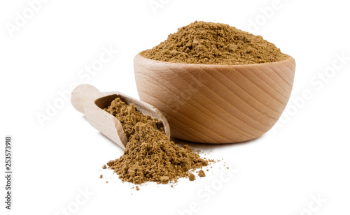 garam masala mix in wooden bowl and scoop isolated on white background. Spices and food ingredients. photo