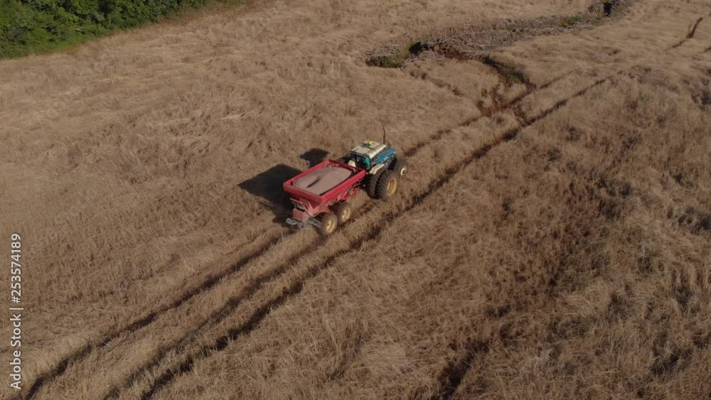 Beautiful Aerial Shot of Tractor in a Field during Soybean Planting Season. Beautiful Aerial Shot of Tractor in a Field during Soybean Planting Season.