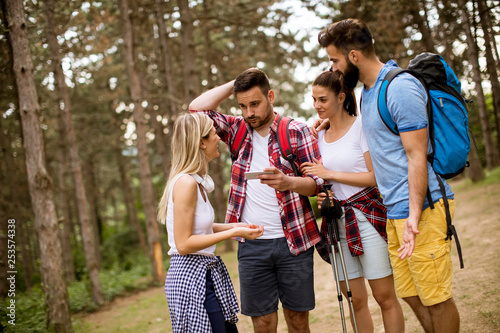 Group of four friends hikin...
