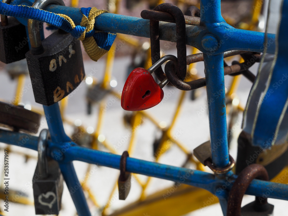 Little red padlock in the shape of heart Little red padlock in the shape of heart