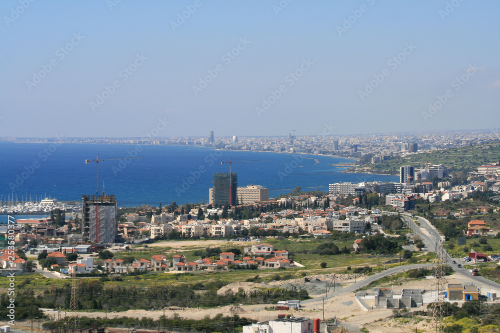 Cityscape and seascape from top of a hill 