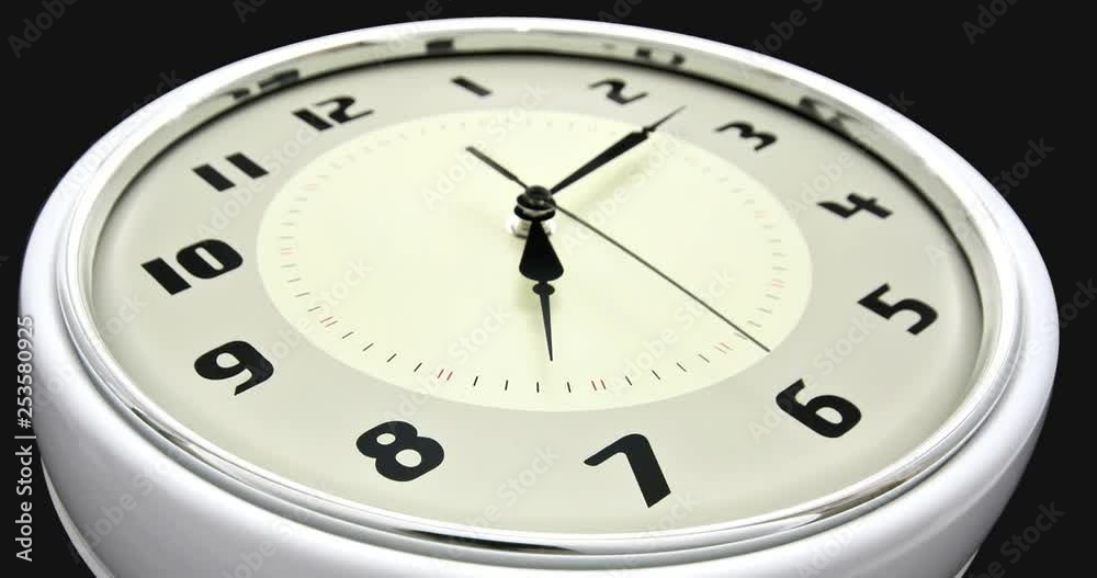 time lapse of a clock going from 7 to 8 macro