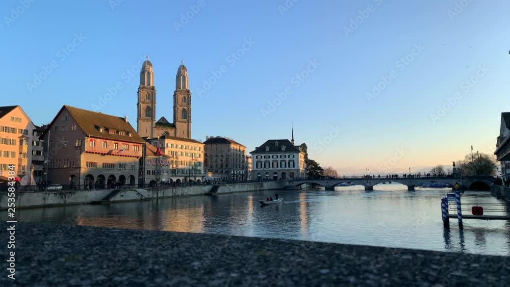 Zürich afternoon by the river Limmat with paddle boat wide shot Zürich afternoon by the river Limmat with paddle boat wide shot