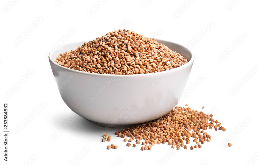 Bowl with uncooked buckwheat on white background Bowl with uncooked buckwheat on white background