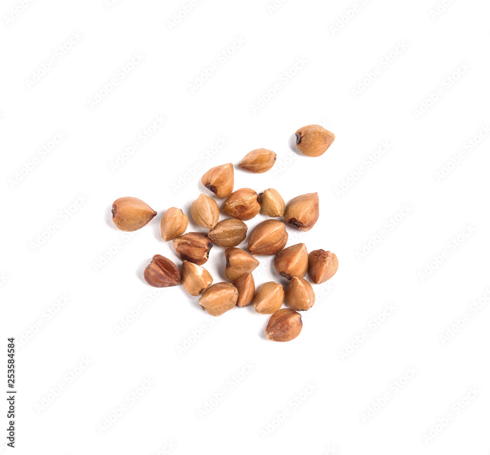 Uncooked buckwheat on white background, top view Uncooked buckwheat on white background, top view