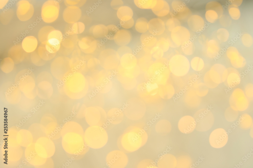 Gold glitter with bokeh effect on light background Gold glitter with bokeh effect on light background