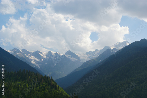 mountains and clouds. Caucasian mountains and white clouds