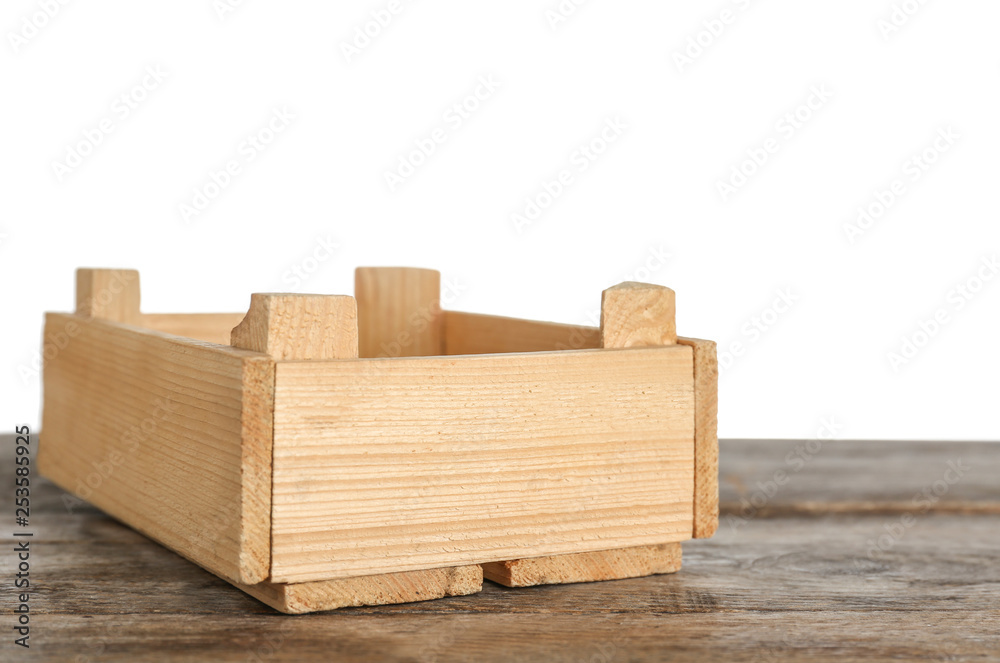 Empty rustic wooden crate on table against white background Empty rustic wooden crate on table against white background
