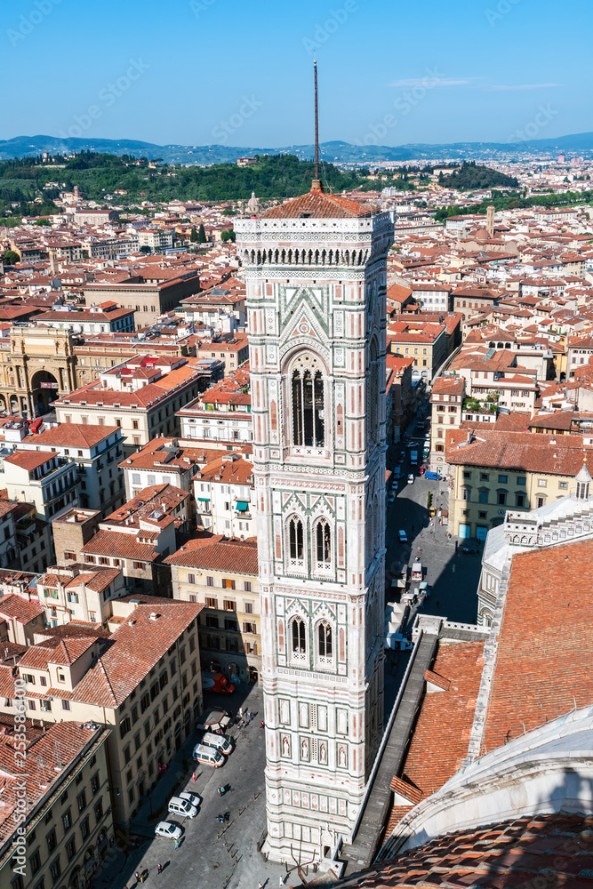 Aerial view of Giotto's Campanile from the top of the Cathedral - Florence, Tuscany, Italy. Giotto Tower was built in 1334 by Giotto and completed in 1359 by Francesco Talenti.
