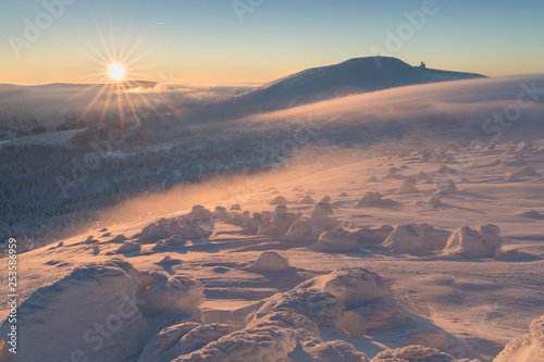 The view on the road Czech and polish friendship in National park Krkonose- Giant mountains. This is the road to the Vysoké kolo - Wielki Szyszak and Wawel in Poland Sunny winter day with snowy trees photo