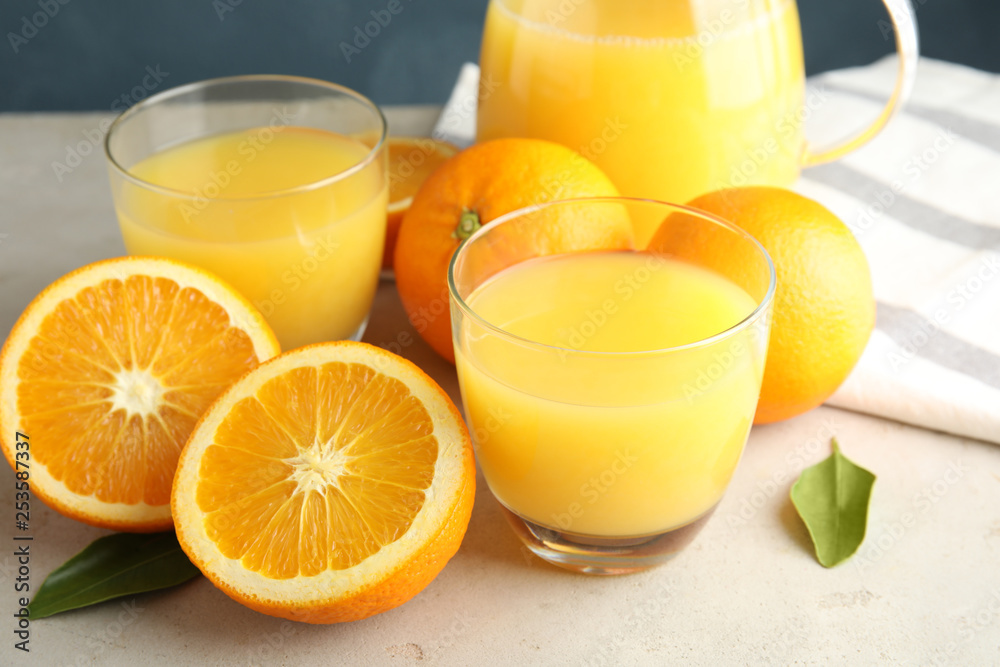 Composition with orange juice and fresh fruit on table Composition with orange juice and fresh fruit on table
