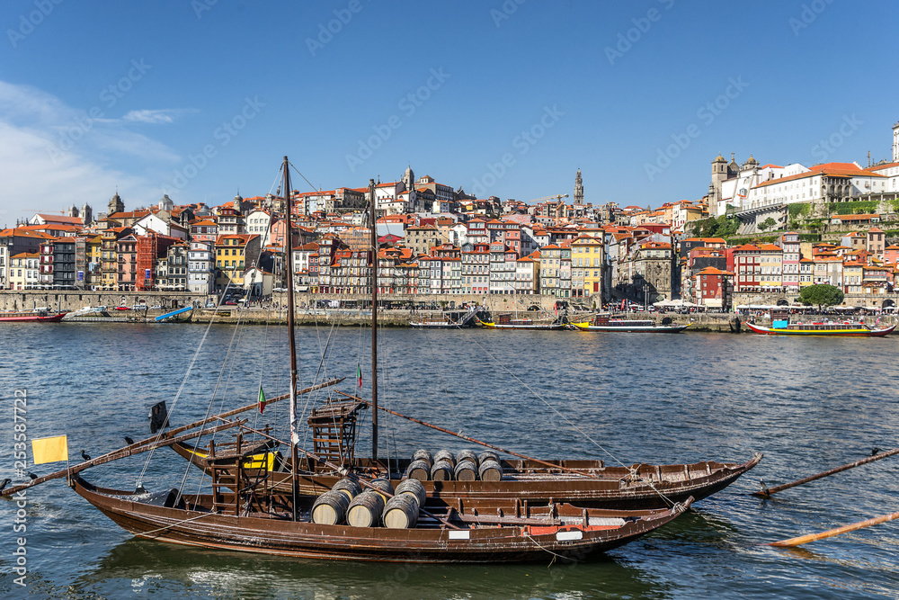 Boats on the Douro river with Riberia in the Background in Porto