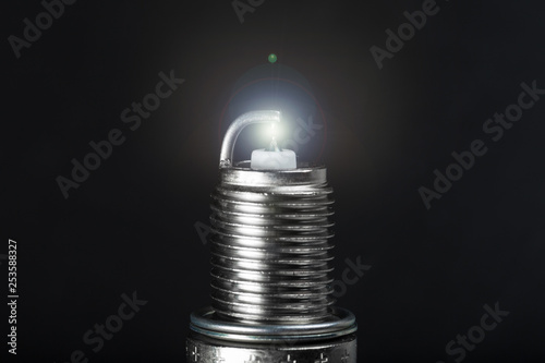 working spark plug with blue sparkle