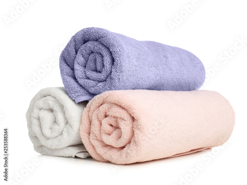 Rolled soft terry towels on white background