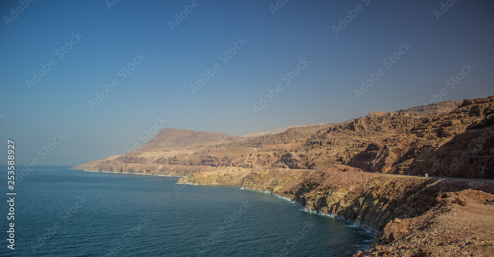 dead sea waterfront beautiful panorama scenery landscape with long bare mountain ridge along shoreline 