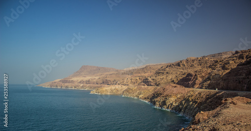 dead sea waterfront beautiful panorama scenery landscape with long bare mountain ridge along shoreline 