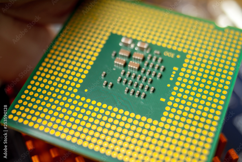 Green electronic chip CPU closeup. Concept of high technology and repair microchip Green electronic chip CPU closeup. Concept of high technology and repair microchip