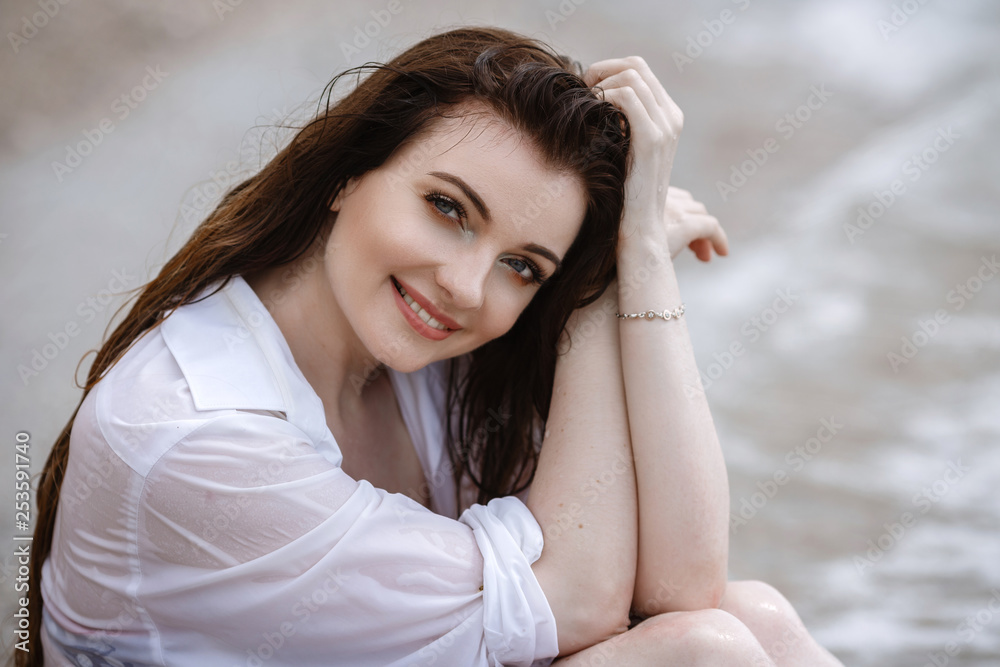 woman in white clothing refreshing at the seaside woman in white clothing refreshing at the seaside