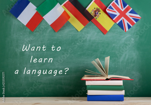 flags of Spain, France, Great Britain and other countries, blackboard with text 