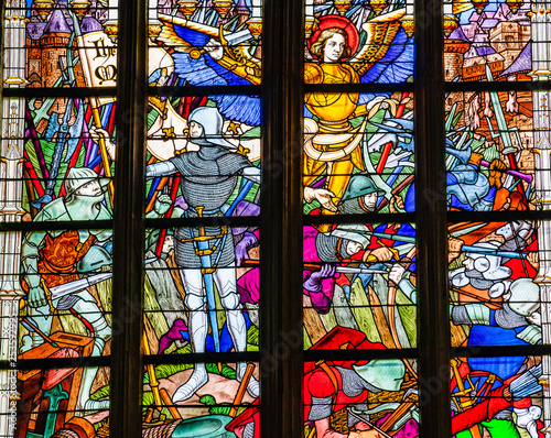 Joan of Arc war scene on colorful stained glass window inside the Cathedral of the Holy Cross in Orleans  France