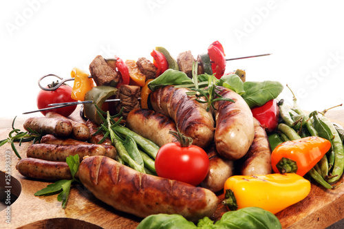 Assorted delicious grilled meat with vegetable on a barbecue. Grilled pork shish or kebab on skewers with vegetables . Food background shashlik