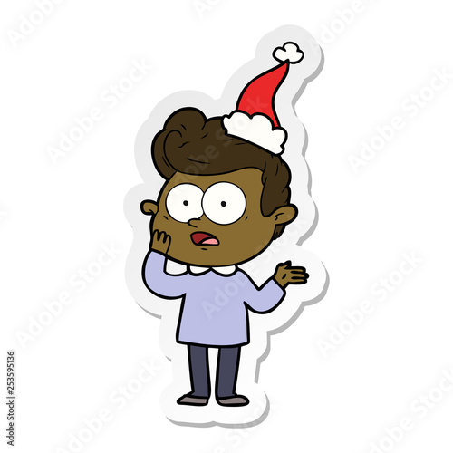 sticker cartoon of a staring man wearing santa hat