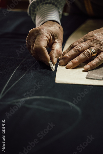 Craftsman tailor at work in the workshop photo