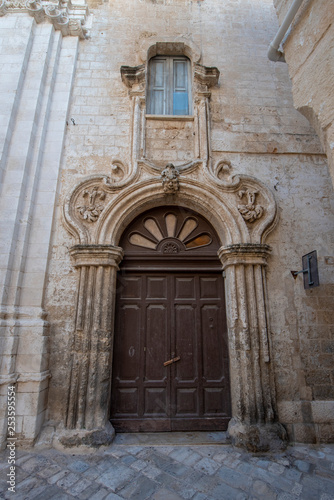 Monopoli  Puglia  Italy - View of street in Monopoli  Apulia. Italian spirit of southern Italy. Beautiful baroque door 