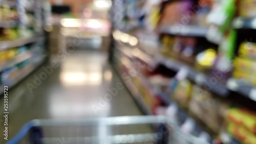 Wallpaper Mural Blurred motion shopping cart moving through the supermarket aisle Torontodigital.ca