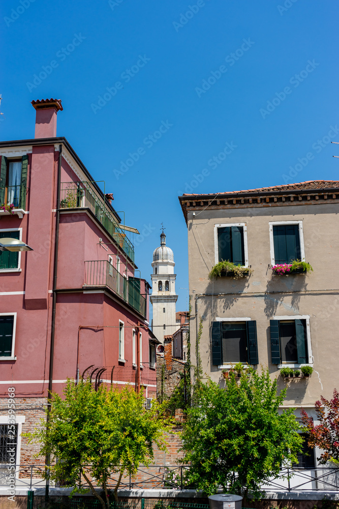 Italy, Venice, a large brick building with a clock on the side of a house