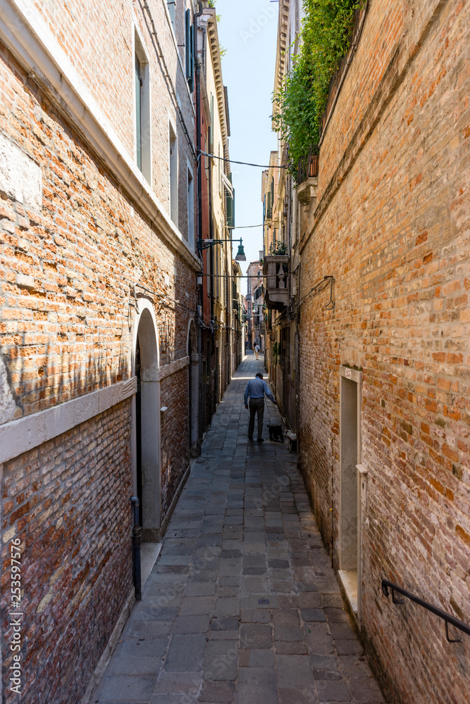 Italy, Venice, a stone building that has a narrow street