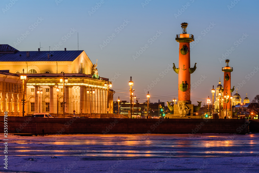 Neva river embankment panoramic landscape in Saint Petersburg. Sights of St. Petersburg, Russia - Rostral columns and the Exchange building.