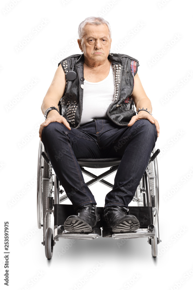 Serious mature male punker in a wheelchair