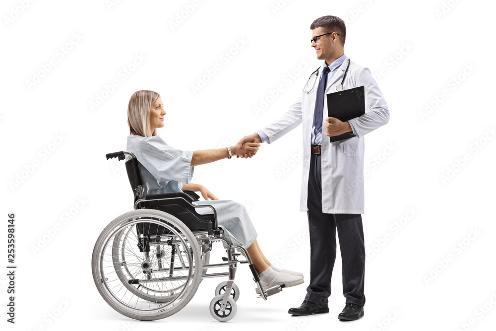 Bearded man in a wheelchair shaking hands with a young woman Bearded man in a wheelchair shaking hands with a young woman