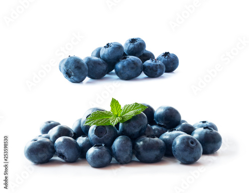 Heap of blueberry fruits isolated on white background. Ripe blueberries with copy space for text. Blueberry isolated on white. Bilberries on a white background. Top view. Blue food.