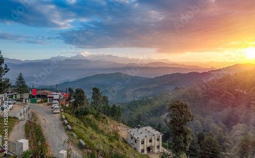Kausani Uttarakhand India hill station at sunrise with view of mountain valley and distant Himalaya snow peaks. photo