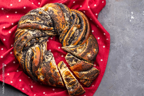 Swirl brioche with poppy seeds. Poppy seed braided or roll bread, Babka. Traditional Polish sweet Christmas bread. photo