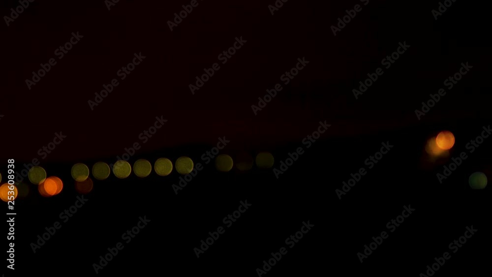 Defocused night time dark black sky with bokeh street and car lights and fireworks in the sky out of focus bokeh circle colorful Defocused night time dark black sky with bokeh street and car lights and fireworks in the sky out of focus bokeh circle colorful