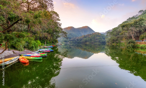 Fototapeta Naklejka Na Ścianę i Meble -  Sattal lake at sunset with scenic landscape and view of tourist boats at Nainital Uttarakhand India.