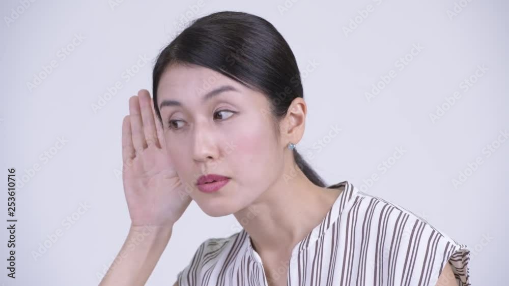 Face of happy beautiful Asian businesswoman thinking and listening Face of happy beautiful Asian businesswoman thinking and listening