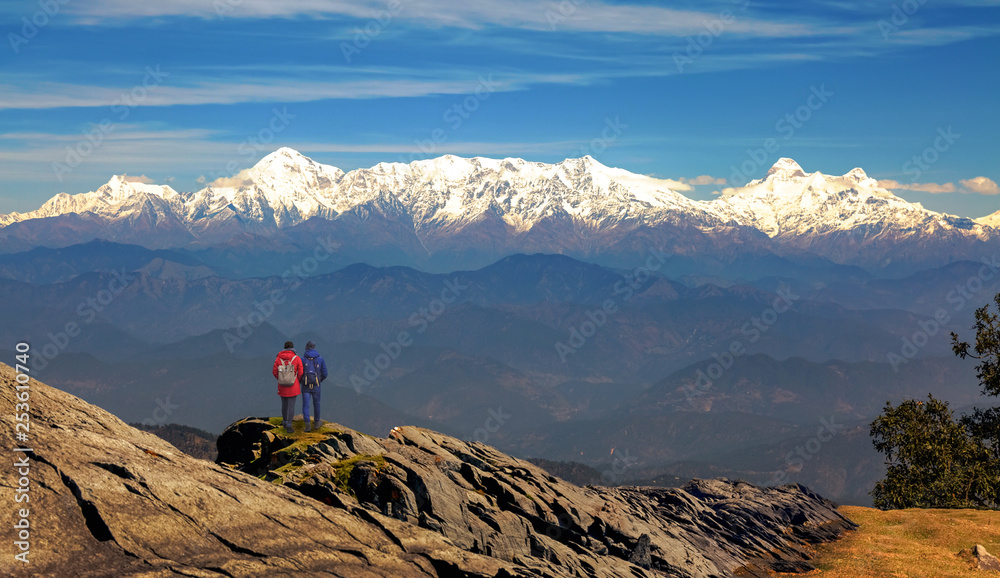 Kumaon Himalaya mountain range with tourist hikers enjoying the view at Uttarakhand India.
