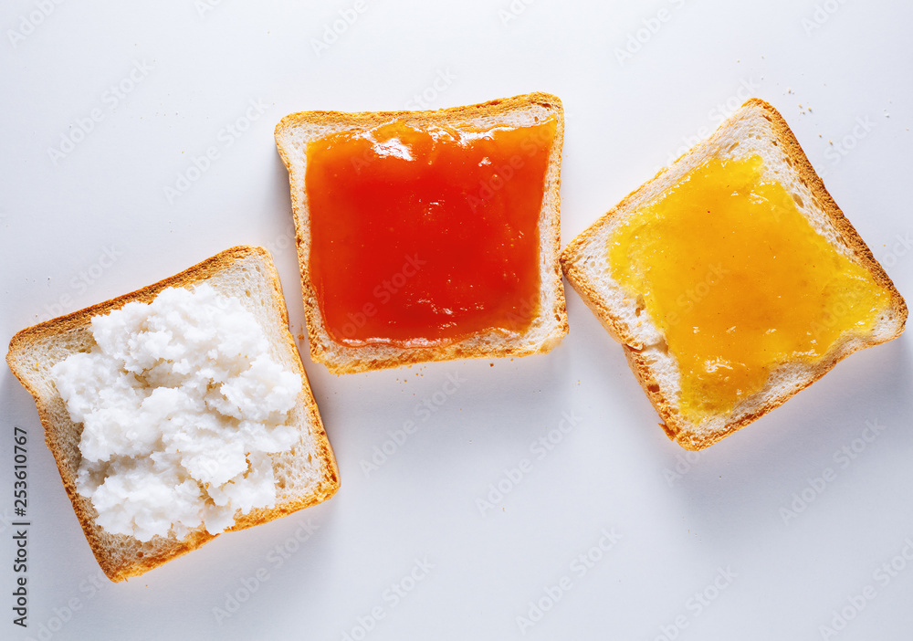  Set of toast with different jams on white background