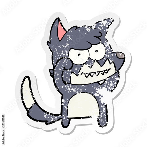 distressed sticker of a cartoon grinning fox
