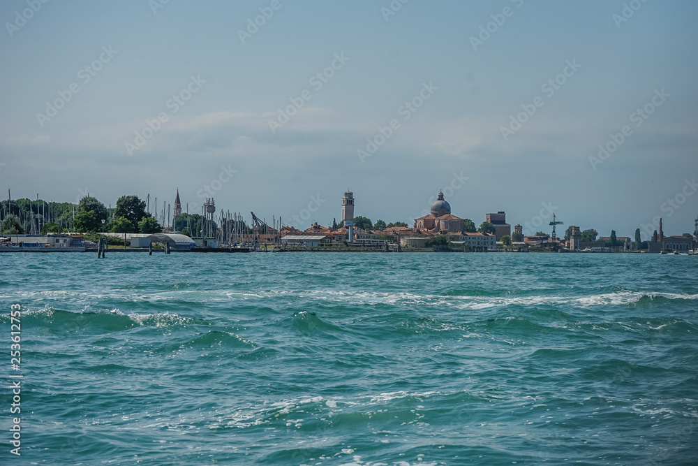 Italy, Venice, a group of people in a large body of water
