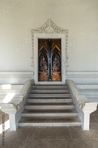 Door and stairs to inside of Wat Kaew Korawaram white temple in Krabi Town in Thailand