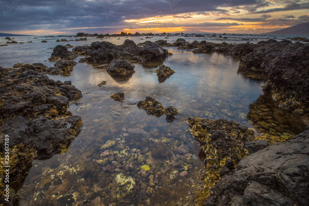 Rocky shoreline sunset on Maui, Hawaii