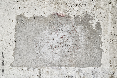 A square patch of concrete with old grunge effect. Place for text.