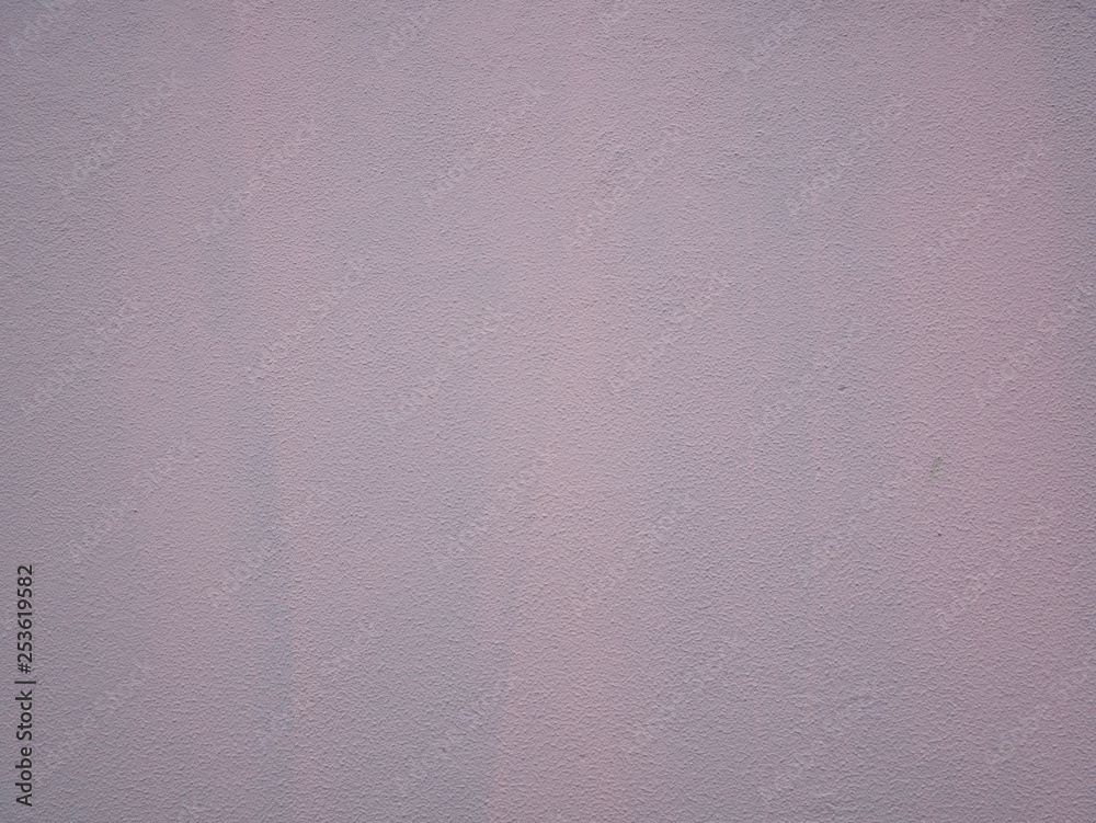 Fototapeta premium Rough pink painted wall, stucco texture.