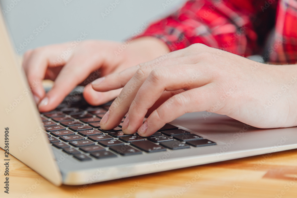 Woman using a laptop, surfing the web, viewing information while having a workplace at home. Blurred trick drawing. Vintage concept.